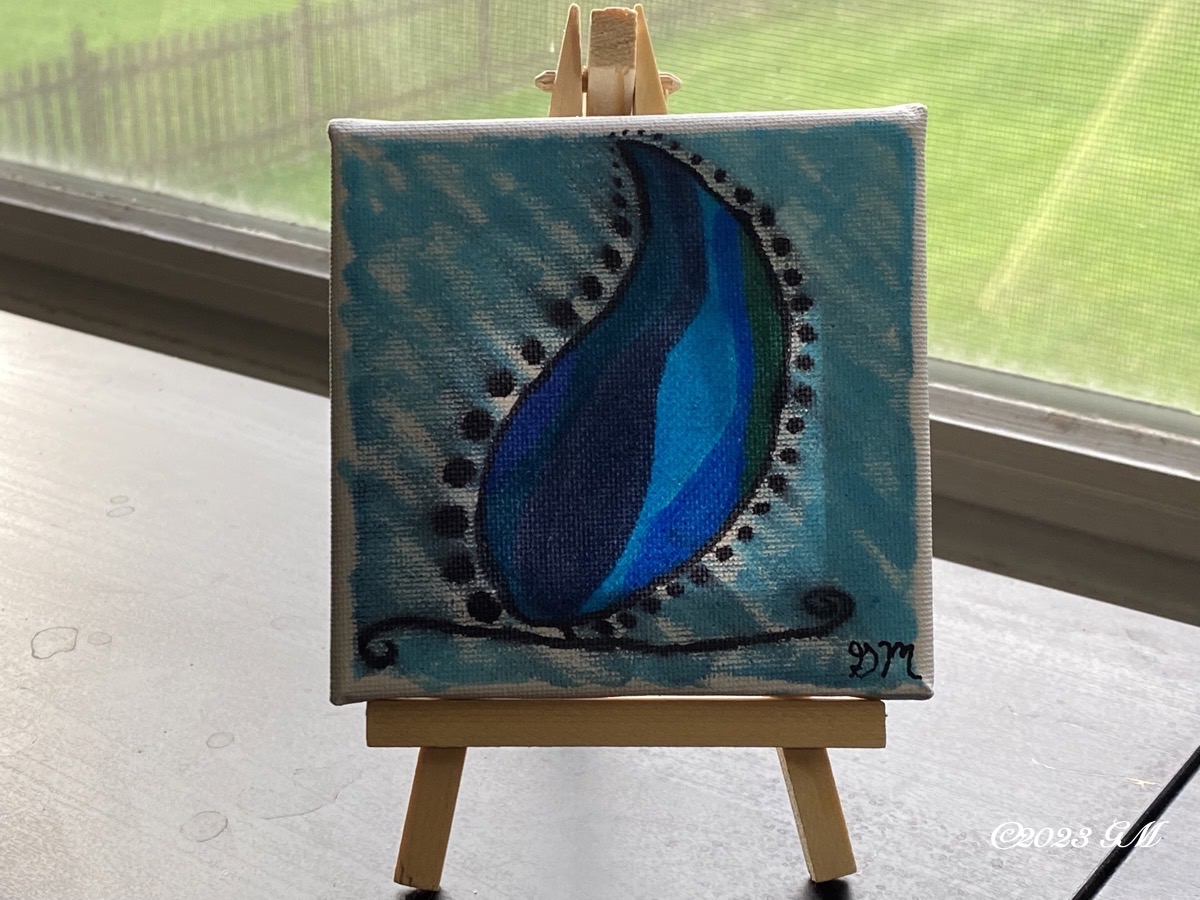 No More Tears painting on a mini easel on a desk in front of a window