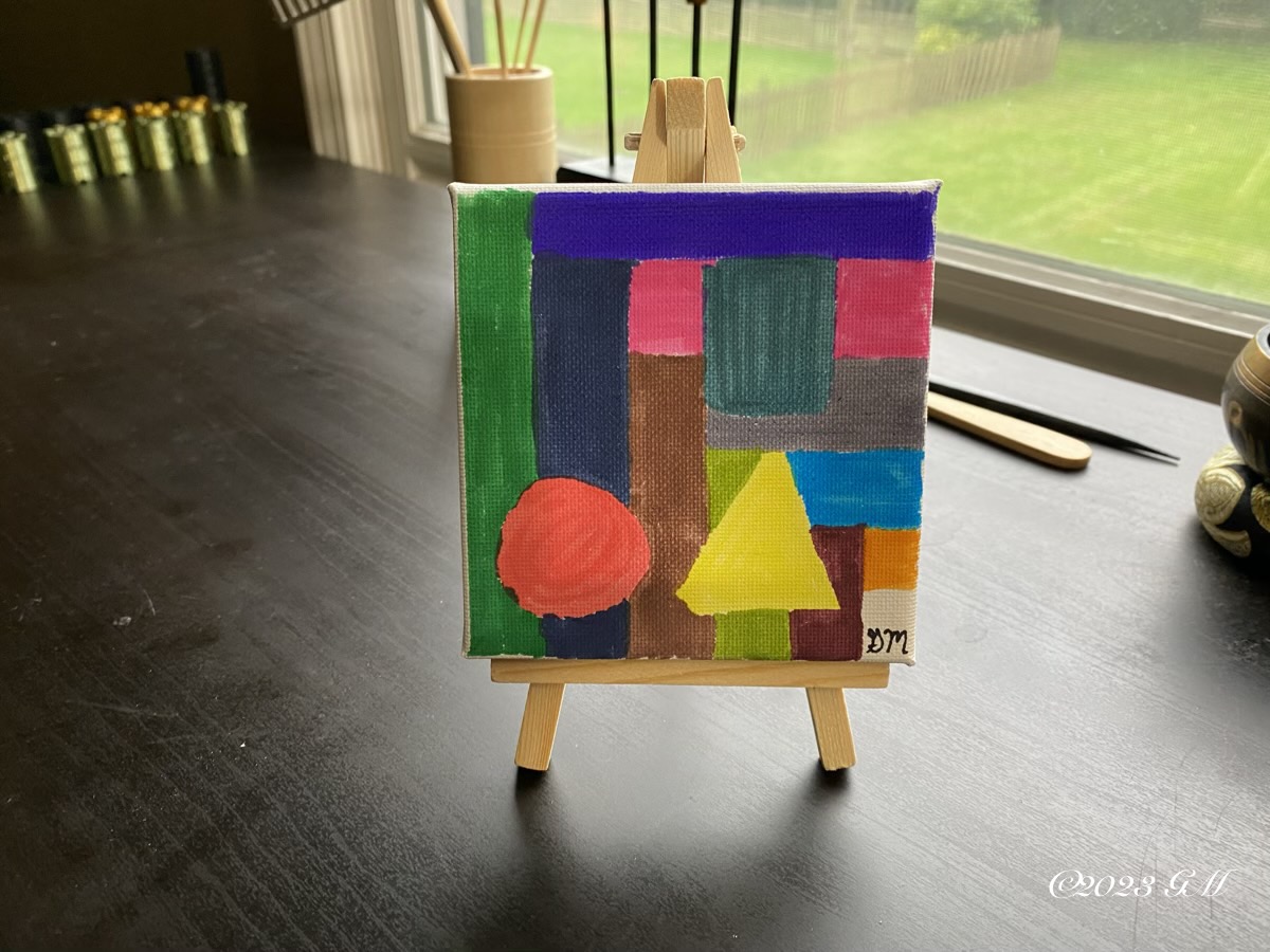 Only the Beginning painting on a mini easel on a desk in front of a window 