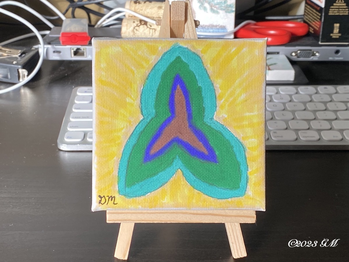 Unnamed painting on a mini easel sitting on a desk in front of a computer